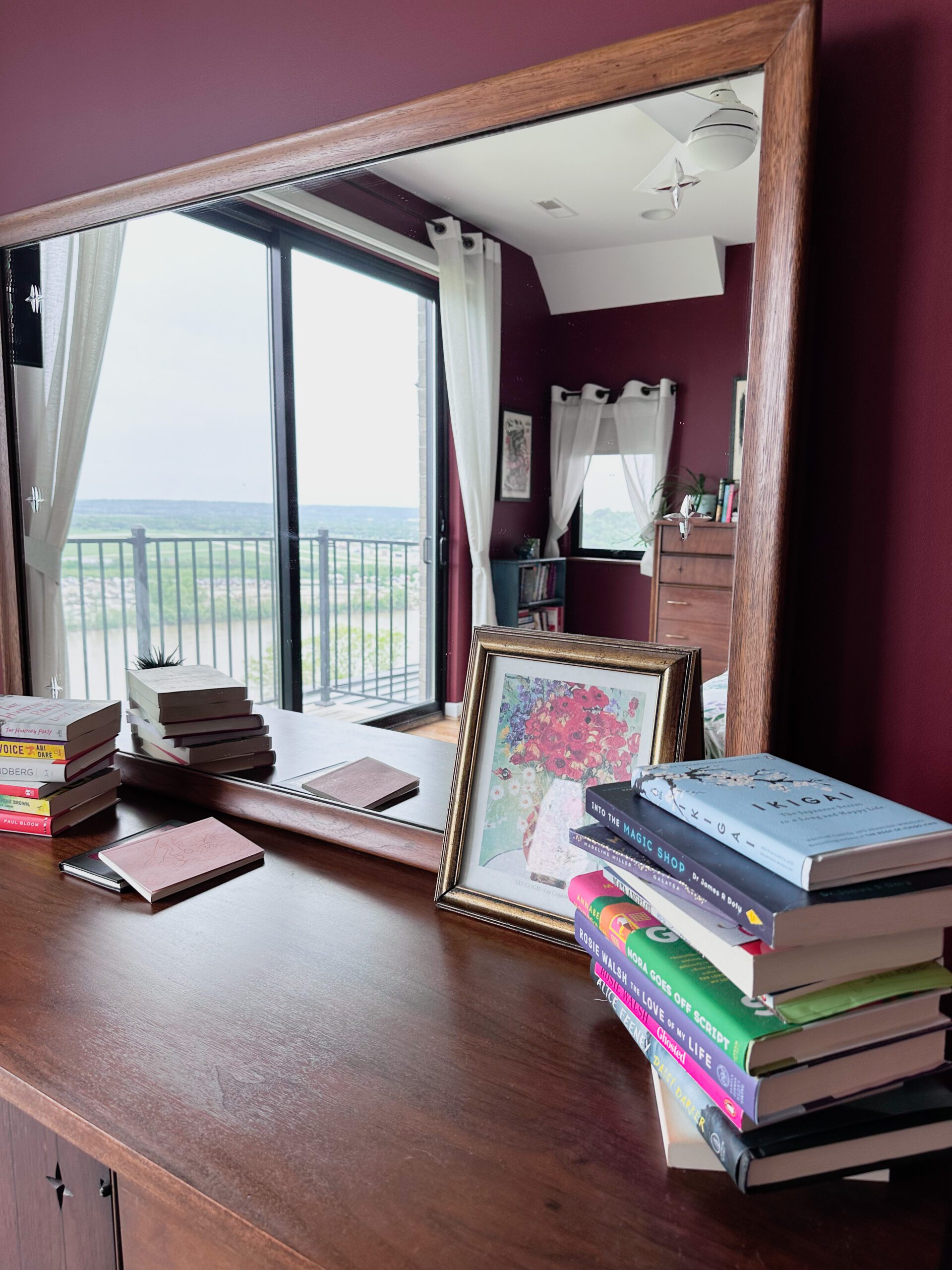 a photo of a primary bedroom painted in Sherwin Williams' Rustic Red Color