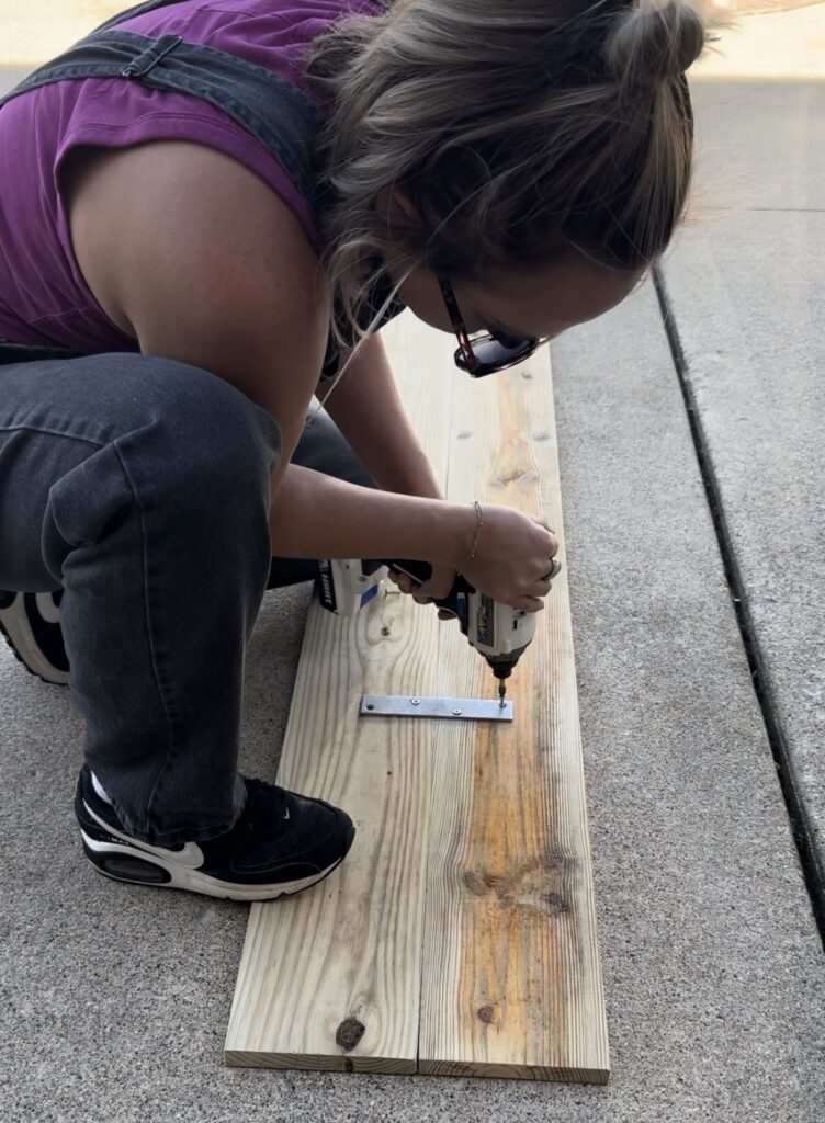 connecting the base pieces together with the hardware.